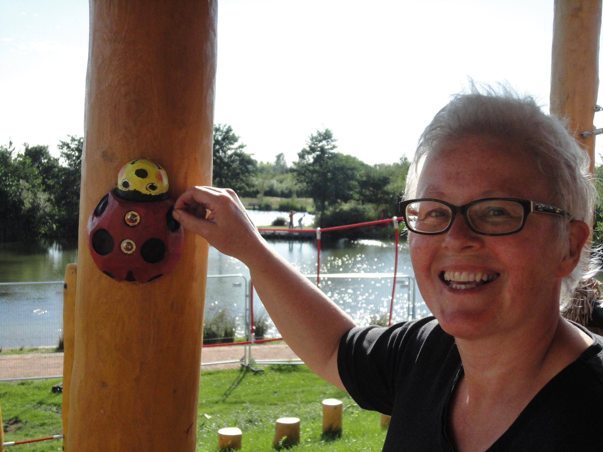 Rinske Wassenaar putting the finishing touches to the ladybird one of the many sculptures and games found throughout this unit at Northala Fields